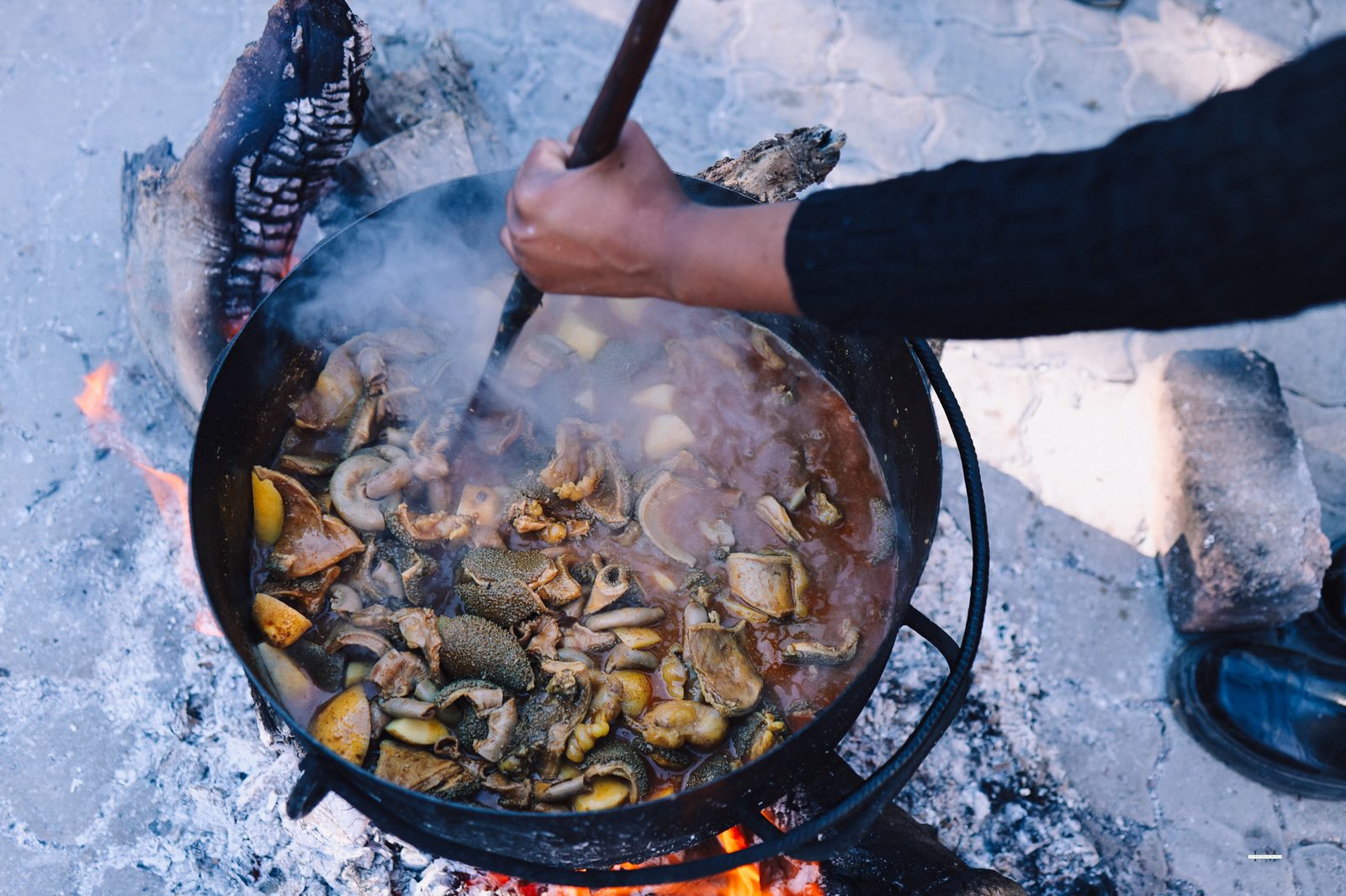 Potjie cooking over the fire at Traditional Sunday