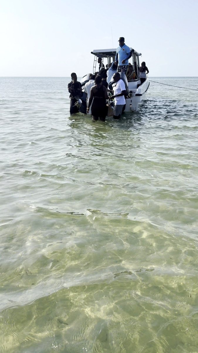 Wading out to the dhow off Bazaruto