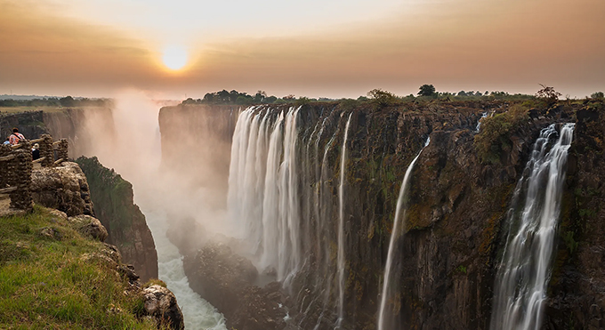 Outjoyment guests hiking to a waterfall in the Zimbabwean highlands